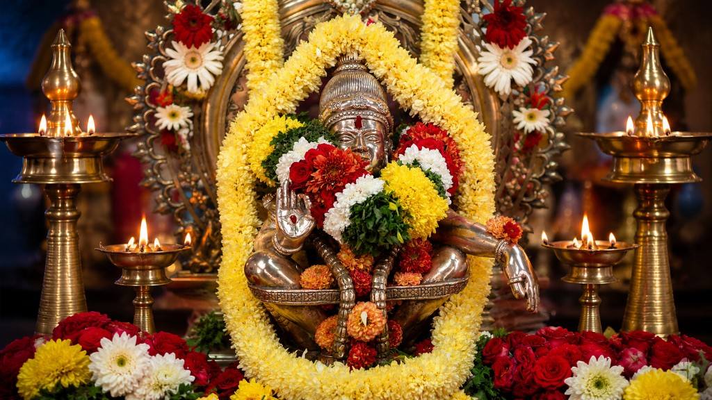 Lord Ayyappa adorned with flowers and lamps — Gottigere Sree Ayyappa Temple